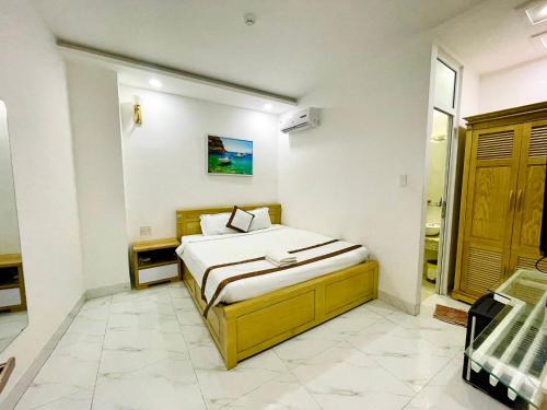 a bedroom with a bed in a room at Diamond Hotel in Vung Tau