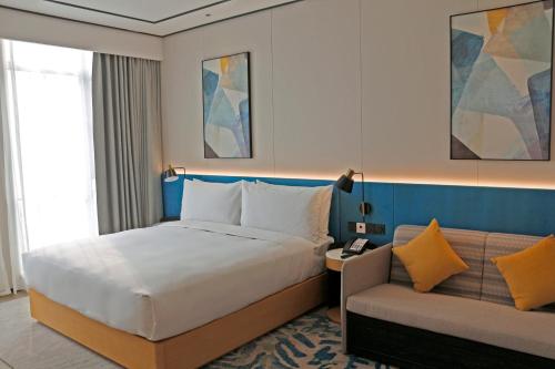 Letto o letti in una camera di Hilton Garden Inn Liaocheng Jiangbei Shuicheng
