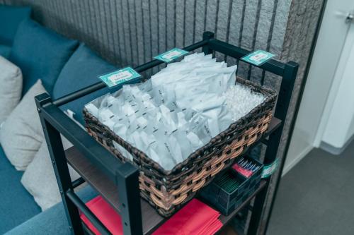 a basket full of toilet paper on a shelf at Global Resort Misen - グローバルリゾート弥山 in Hatsukaichi