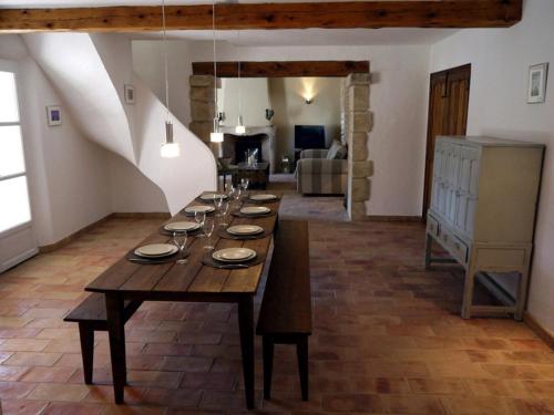 a long wooden table in a living room at La Bergerie Provencale - Luberon - Provence - villa with heated pool in Roussillon