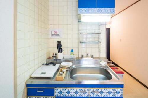 a kitchen with a sink and a counter top at Chez Moi royale in Tokyo