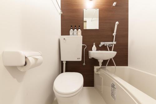 a bathroom with a toilet and a sink at Chez Moi royale in Tokyo