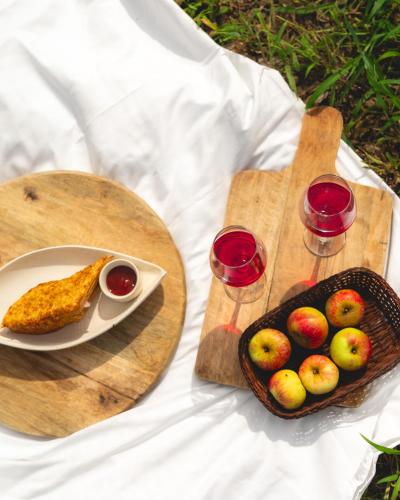 a table with two cutting boards and a plate of fruit at The Soul Stroll Cottages Retreat in Mukteswar