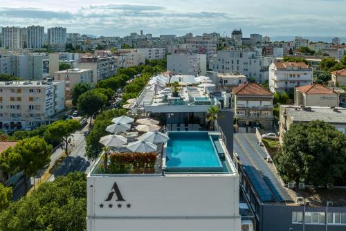 an aerial view of a building with a swimming pool at Art Hotel in Split