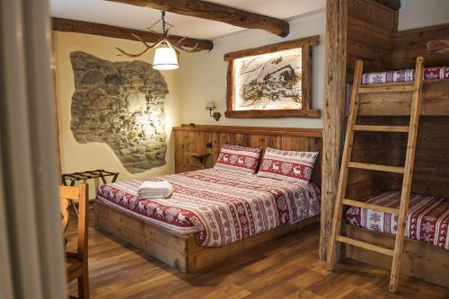 Postel nebo postele na pokoji v ubytování Le Petit Fenestrelle