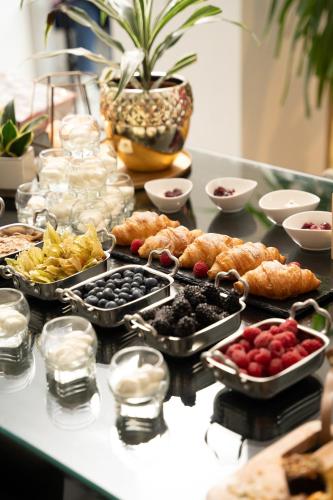 a table topped with lots of different types of food at INNSiDE by Meliá Leipzig in Leipzig