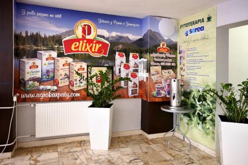 a food store with a sign on the wall at Hotel SOREA ĽUBOVŇA in Stará Ľubovňa