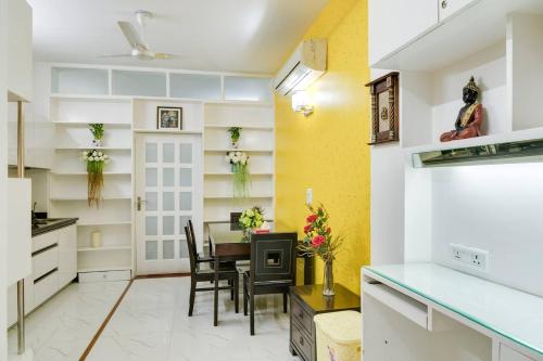 a kitchen and dining room with a table and chairs at Moydom Nice & Cosy Private 1 BHK Apartment OPP NFC market in New Delhi