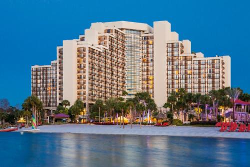 a large building on the beach in front of a resort at Hyatt Regency Grand Cypress Resort in Orlando