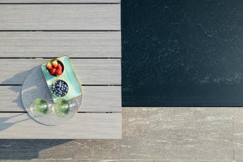 a bowl of fruit on a plate on a table at Maison MUSA at Vita B in Lenno