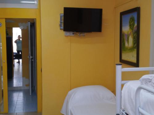 Télévision ou salle de divertissement dans l'établissement Hostel Le Stanze del Sogno