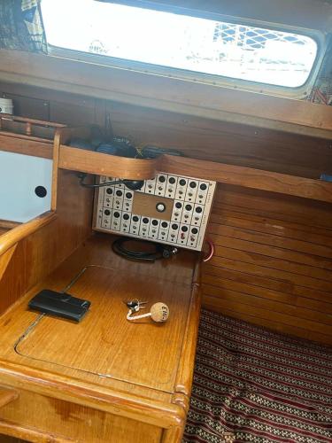 a small room with a table and a window at Lovely Sailingboat room near center in Helsinki