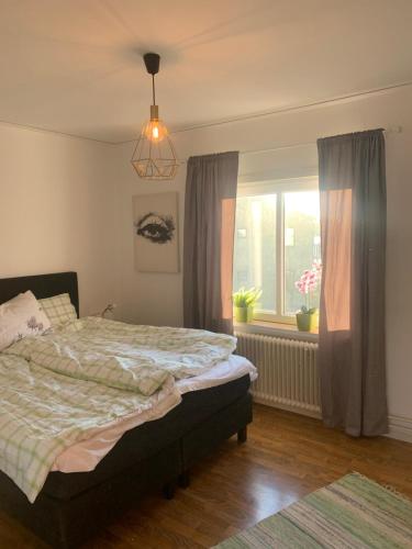 a bedroom with a bed and a window at 4 Bed Apartment with balcony in Karlskrona in Karlskrona