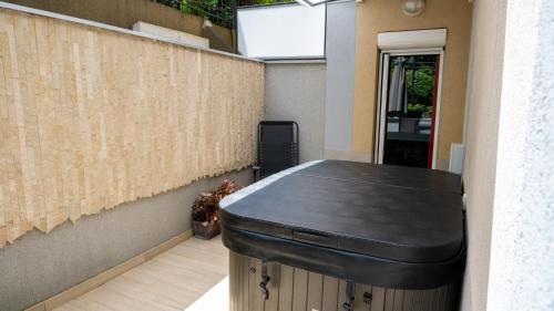 a black counter in a room with a wall at Apartments Biser in Vrnjačka Banja
