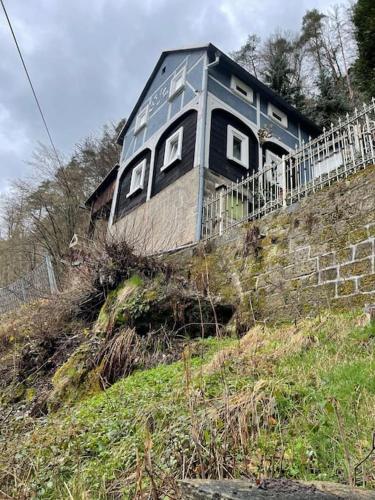 a house sitting on top of a hill at Villa u Rytíře in Hřensko