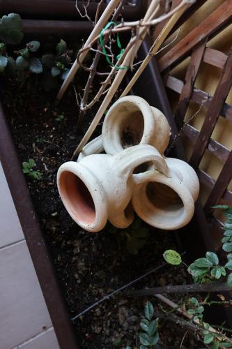 a group of white vases sitting on the ground at Rabatè in Agrigento