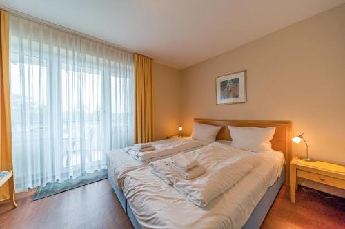Ένα ή περισσότερα κρεβάτια σε δωμάτιο στο Hus Inselkieker Hus Inselkieker 108