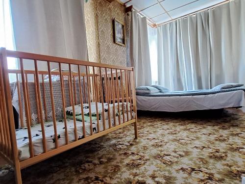 a bedroom with two bunk beds and a window at Liepājas brīvdienu māja ar dārzu in Liepāja