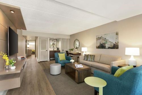 a living room with a couch and a table at Hotel Alba Tampa, Tapestry Collection By Hilton in Tampa