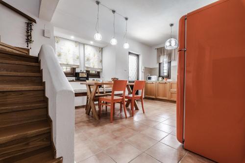 a kitchen and dining room with a table and chairs at Villa 10 Elies in Koropi