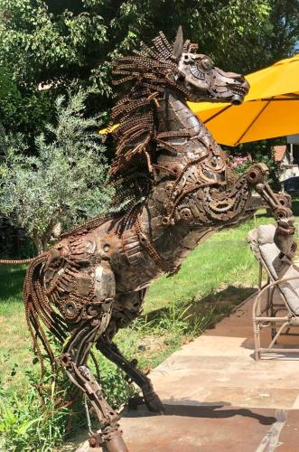 a statue of a statue of a horse on a sidewalk at Villa Pauline in Avignon