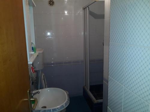 a bathroom with a shower and a sink at Bulevar apartment Budva in Budva