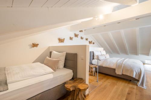 a bedroom with two beds in a attic at Chalet Gipfelstürmer in Oberstdorf