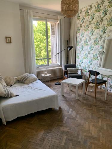 a bedroom with a bed and a living room at Marseille Vieux Port in Marseille