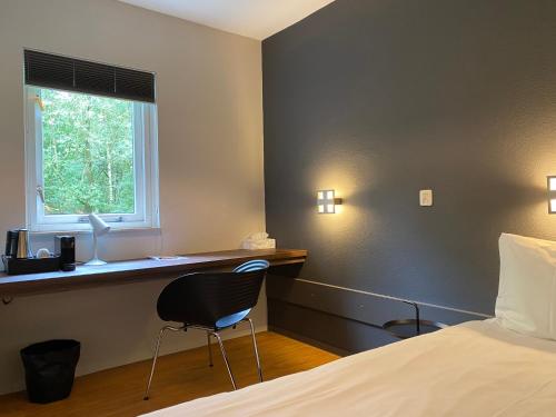 Postel nebo postele na pokoji v ubytování Hotel Kapellerput Heeze-Eindhoven