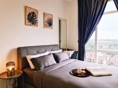a bedroom with a large bed with a window at New! 4-6pax Mount Austin High Condo in Johor Bahru in Johor Bahru