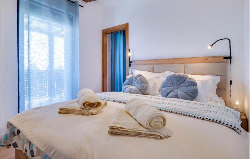 a bedroom with a large bed with towels on it at Awesome Home In Sedlarica With Private Swimming Pool, Can Be Inside Or Outside 