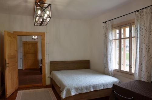 a bedroom with a bed and a window at Вершище in Urych