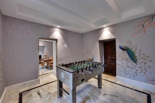a room with a foosball game on the wall at The Fern Bambora Fort, Bambora, Udaipur in Udaipur