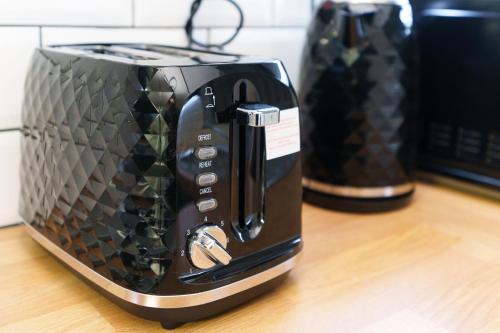 a black toaster sitting on top of a counter at Spencer House in Leeds