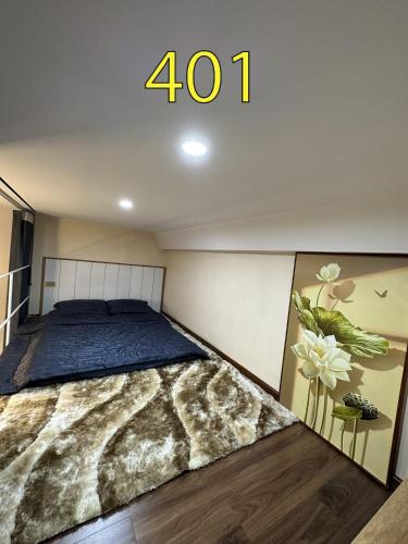 a bedroom with a large bed with the number at Hồng Vân Homestay in Cao Bằng