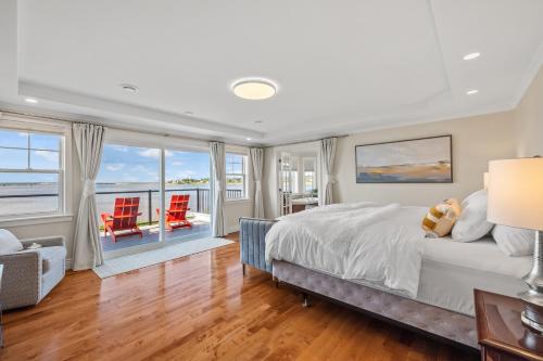 a bedroom with a bed and a view of the ocean at Harbour View Haven in Stratford