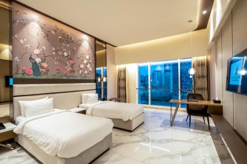 Ein Bett oder Betten in einem Zimmer der Unterkunft Seven Eleven Hotels and Club