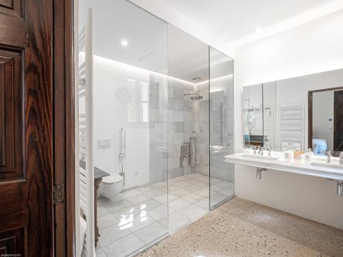 a bathroom with a shower and a toilet and a sink at Ca'n Puig de Sòller in Sóller