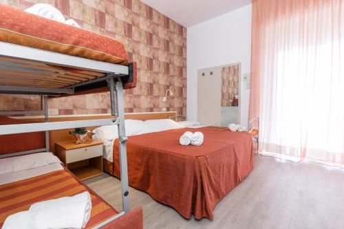 Postel nebo postele na pokoji v ubytování Hotel Dusseldorf