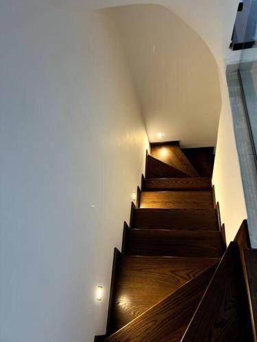 a set of stairs in a building with wooden floors at The Yacht House in Agios Ioannis Pelio