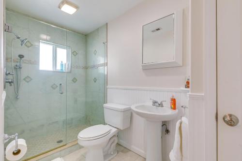 a bathroom with a toilet and a shower and a sink at Luxury Gem with Private Pool and Dock in Apollo Beach in Apollo Beach