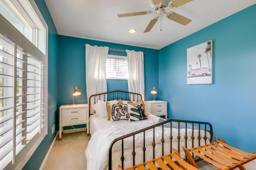 a blue bedroom with a bed and a ceiling fan at Luxury Gem with Private Pool and Dock in Apollo Beach in Apollo Beach