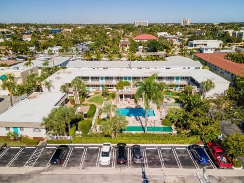 an aerial view of a parking lot in front of a building at The Floranada Condo at Pompano Beach 9 in Pompano Beach