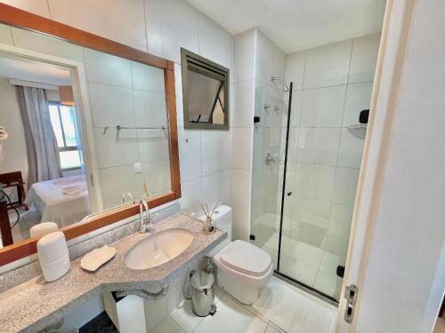 a bathroom with a toilet and a sink and a shower at Resort VG SUN por Be My Guest! in Caucaia