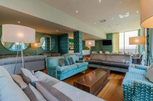 a large living room with couches and a table at Olissippo Oriente in Lisbon