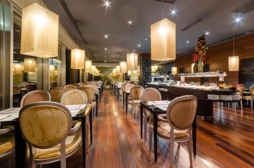 a row of tables and chairs in a restaurant at Olissippo Oriente in Lisbon