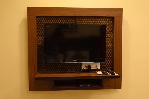 a flat screen tv in a wall at Hotel Plaza Inn, Ajmer in Ajmer