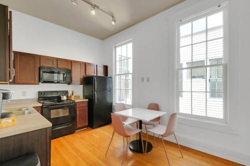 a kitchen with a table and chairs in it at Guthrie Coke Lofts, Walkable Entertainment in Louisville