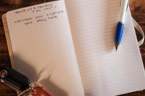 a pen and a piece of paper with a note at poppy loft in Grottaferrata