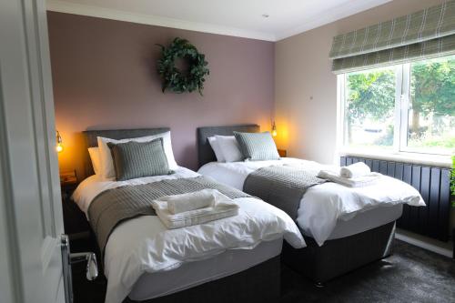 Voodi või voodid majutusasutuse Bedale View Lodge toas